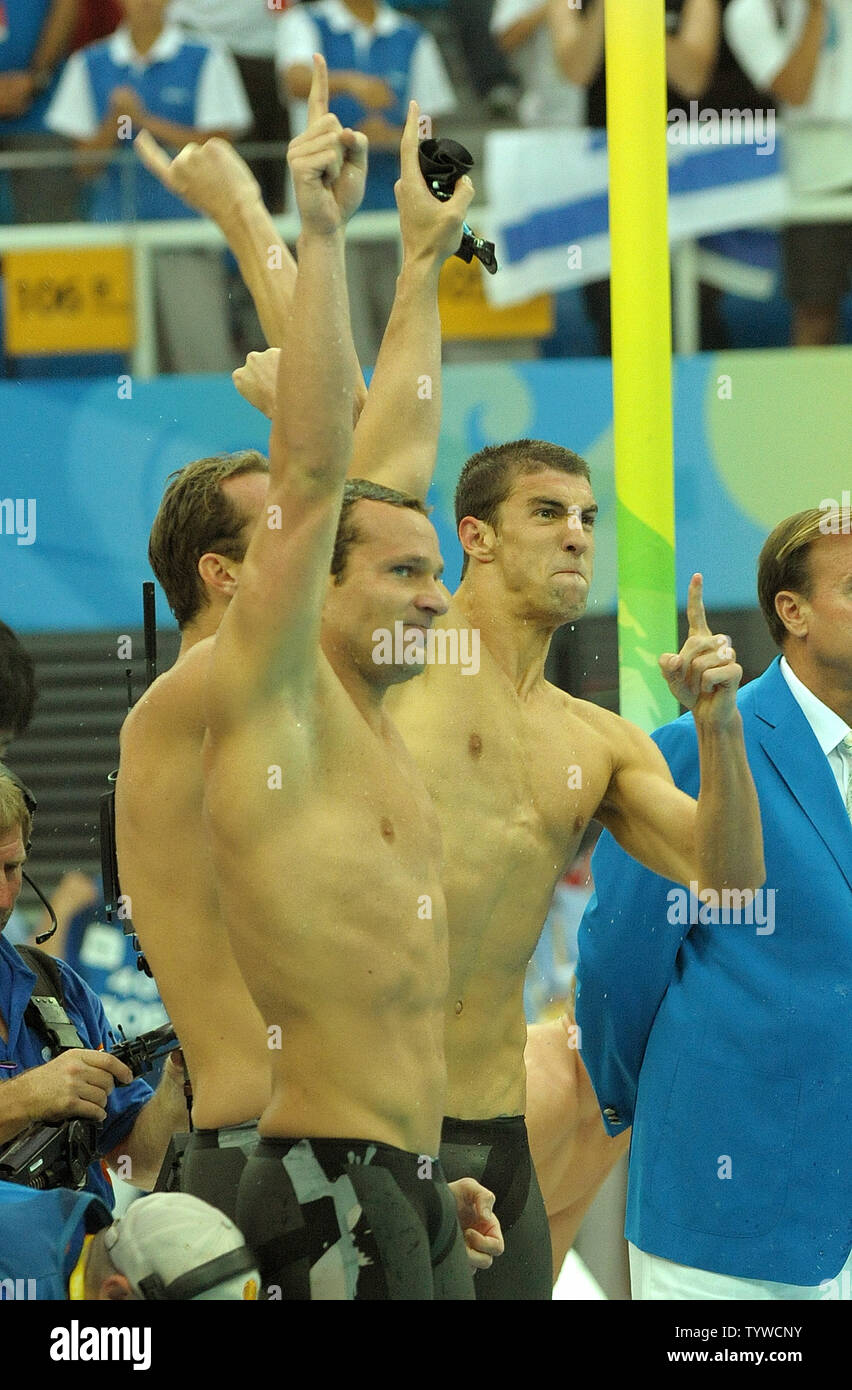 USA's Michael Phelps (R) and team mate Brendan Hansen cheer as the US team wins the Men's 4x100M Medley, setting a world record of 3:29.34, at the National Aquatic Center (Water Cube) during the 2008 Summer Olympics in Beijing, China, on August 17, 2008.  Phelps set the world record for medals in a single Olympics with 8, passing Mark Spitz.    (UPI Photo/Roger L. Wollenberg) Stock Photo