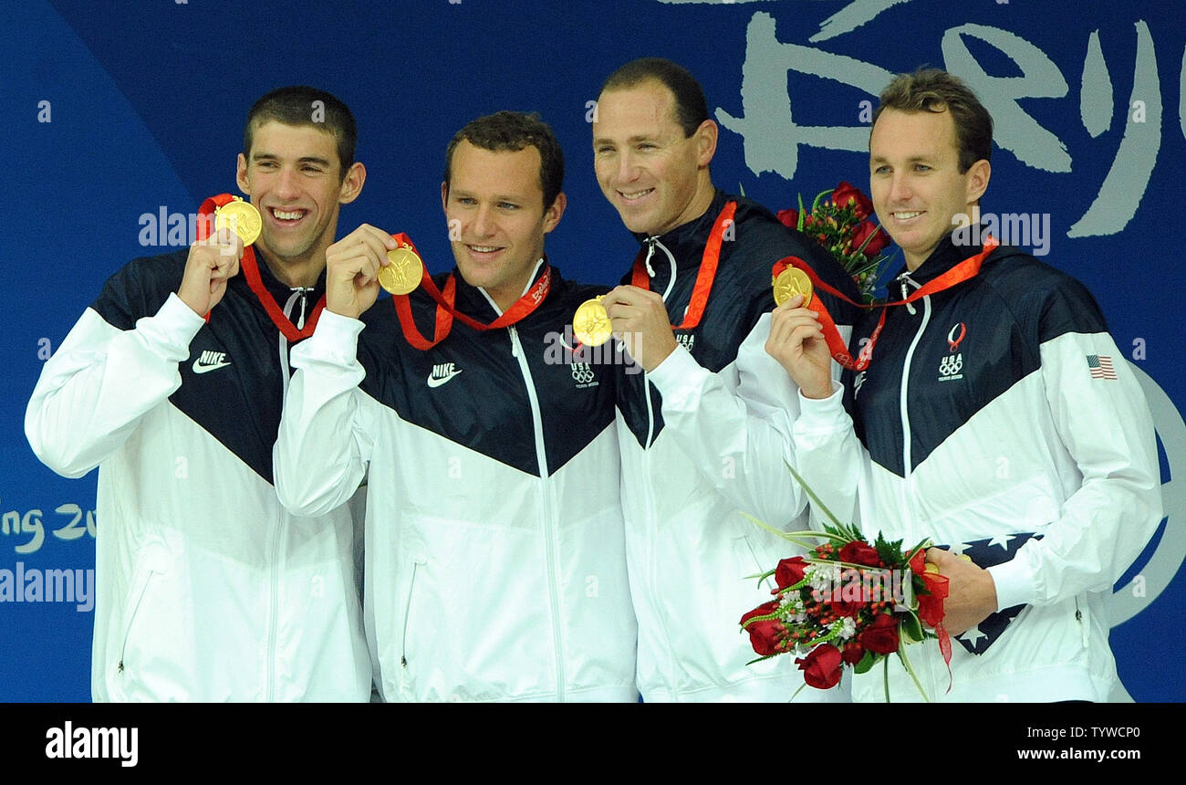 USA's Michael Phelpps, Brendan Hansen, Jason Lezak and Aaron Peirsol (l to r) hold up their medals won in the Men's 4x100M Medley, setting a world record of 3:29.34, at the National Aquatic Center (Water Cube) during the 2008 Summer Olympics in Beijing, China, on August 17, 2008.  Phelps set the world record for medals in a single Olympics with 8, passing Mark Spitz.    (UPI Photo/Roger L. Wollenberg) Stock Photo