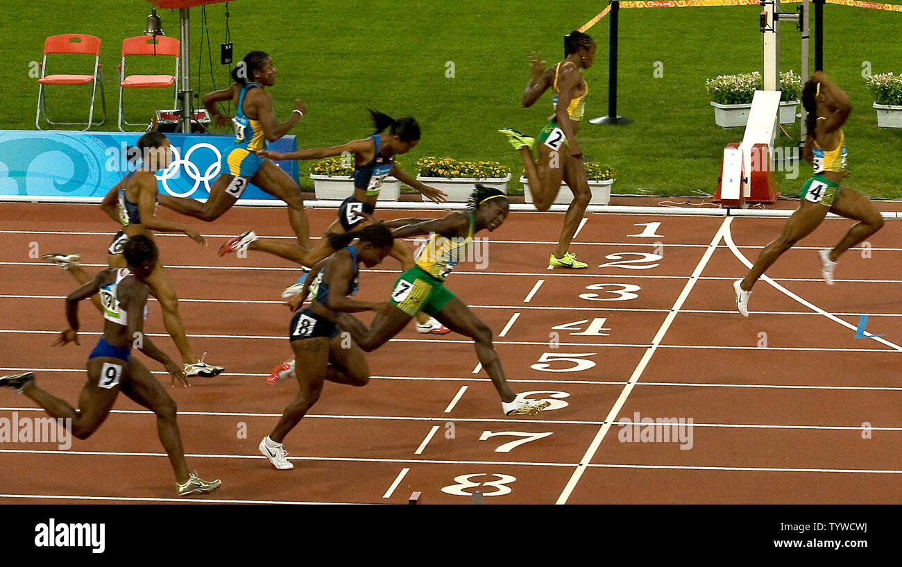 Jamaica's Shelly-Ann Fraser (R) sprints to the finish line to win gold in the Olympic Women's 100m event in 10.78 in Beijing August 17, 2008.  Shelly-Anne beat (Top to Bottom, lane numbers) teammate Sherone Simpson (2), Bahamas' Debbie Ferguson-McKenzie (3), USA's Muna Lee (5), Torri Edwards (6), teammate Kerron Stewart (7), USA's Lauryn Williams (8) and Britain's Jeanette Kwakye (9).   Simpson and Stewart tied at 10.98 for silver, with Williams taking the bronze in 11.03.   (UPI Photo/Stephen Shaver) Stock Photo