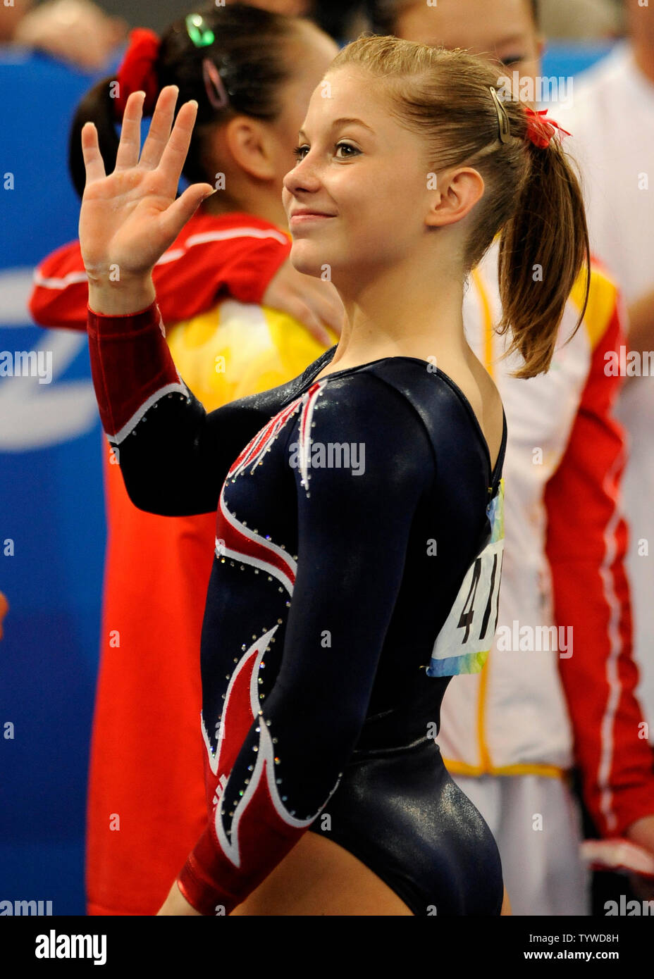 American gymnast Shawn Johnson waves after she won the gold medal for