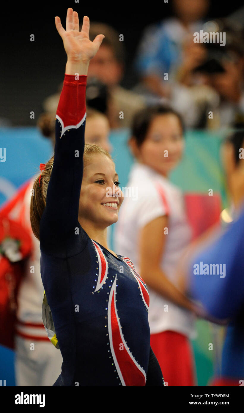 American gymnast Shawn Johnson waves after she won the gold medal for
