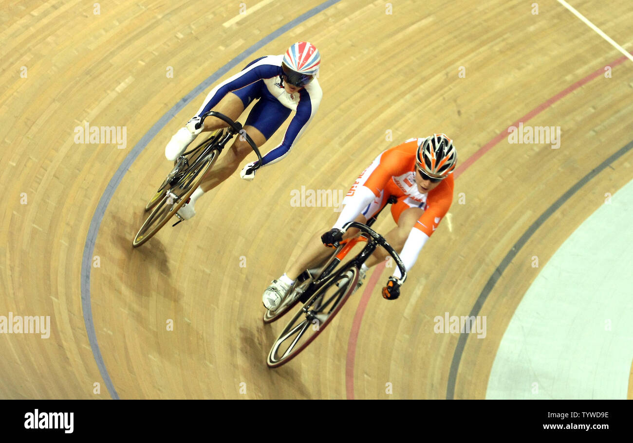 Britain's Victoria Pendleton (L) cycles behind Netherland's Willy Kanis during the Women's Sprint Semifinals at the Laoshan velodrome in Beijing August 19, 2008.  Pendleton 2-0.   (UPI Photo/Stephen Shaver) Stock Photo