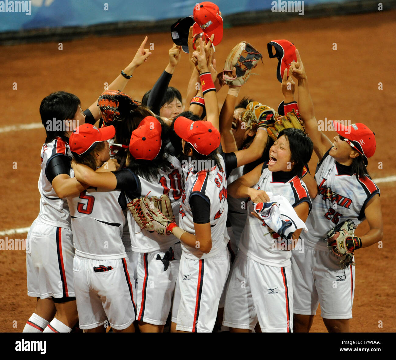 Japanese women's softball team celebrate the last out, as Japan wins the gold medal against the USA women's team, 3-1, at Fengtai Softball Field,  August 21, 2008, at the Summer Olympics in Beijing. The USA team had beaten Japan in an earlier match.  Australia won the bronze.      (UPI Photo/Mike Theiler) Stock Photo