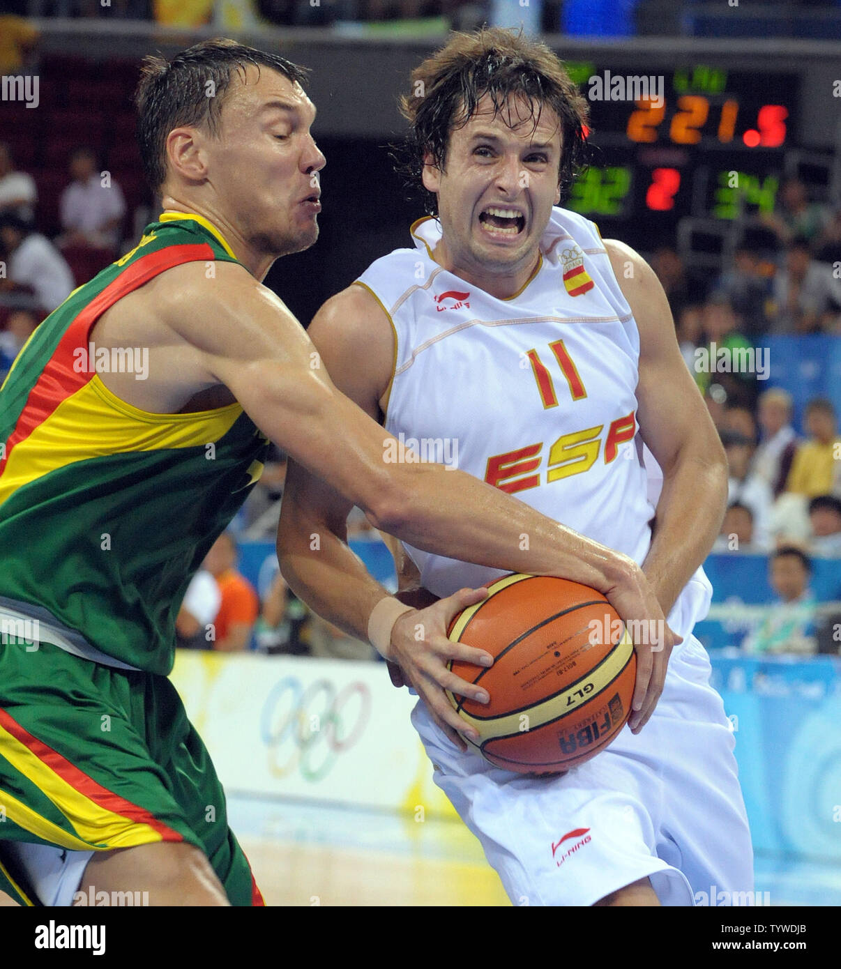 Spain's Raul Lopez drives to the net as Lithuania's Sarunas Jasikevicius  defends in the second quarter of their seminfinal Men's Basketball game  during the 2008 Summer Olympics in Beijing on August 22,