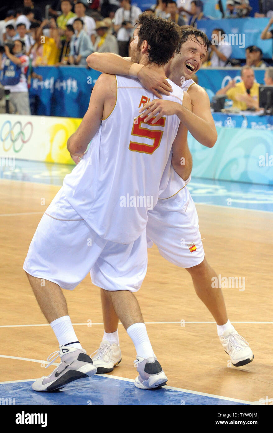 Spain's Rudy Fernandez (L) and Spain's Raul Lopez celebrate after defeating  Lithuania in their seminfinal Men's Basketball game during the 2008 Summer  Olympics in Beijing on August 22, 2008. Spain won 91-86. (