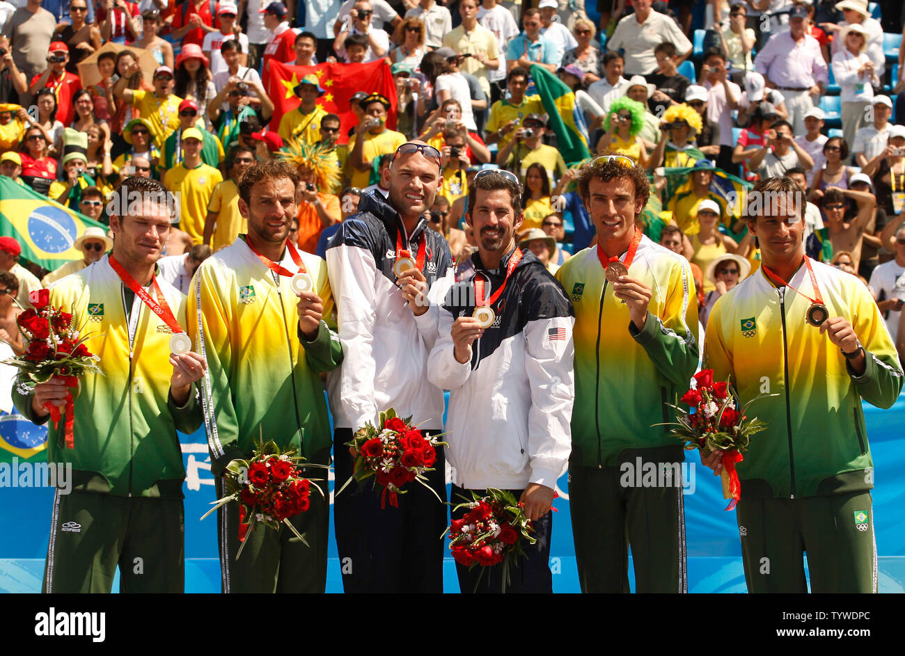 (L-R) Silver medalists Fabio Magalhaes and Marcio Araujo of Brazil, gold medalists Philip Dalhausser and Todd Rogers of the U.S. and bronze medalists Emanuel Rego and Ricardo Santos of Brazil celebrate on the podium during the men's beach volleyball medal ceremony at the Beijing 2008 Olympic Games August 22, 2008.   (UPI Photo/Stephen Shaver) Stock Photo
