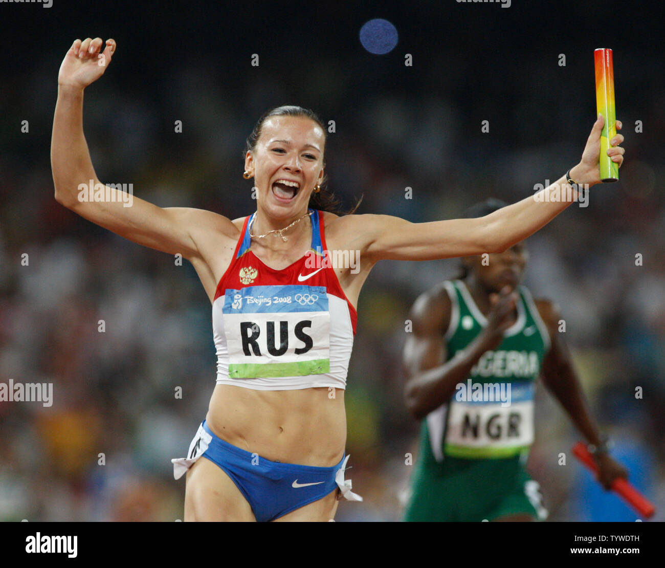 Yuliya Chermoshanskaya of Russia celebrates winning the women's 4x100m relay at the 2008 Summer Olympics in the National Stadium in Beijing on August 22, 2008. Russia won gold with a time of 42.31.    (UPI Photo/Terry Schmitt) Stock Photo