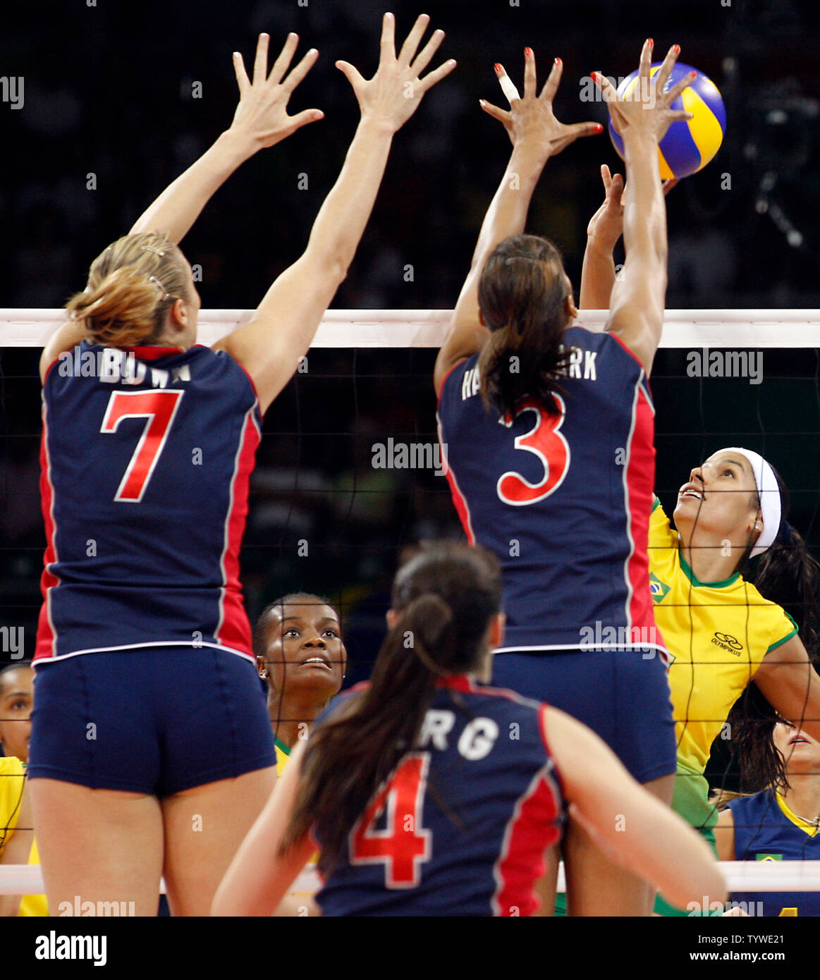 Brazil's Paula Pequeno's (R) spike is blocked by USA's defenders (L-R) Heather Bown, Lindsey Berg and Tayyiba Haneff-Park in the women's volleyball final during the Beijing 2008 Olympic Games August 23, 2008. Brazil won the match 3-1, taking the gold, while USA settled for silver and China the bronze.  (UPI Photo/Stephen Shaver) Stock Photo