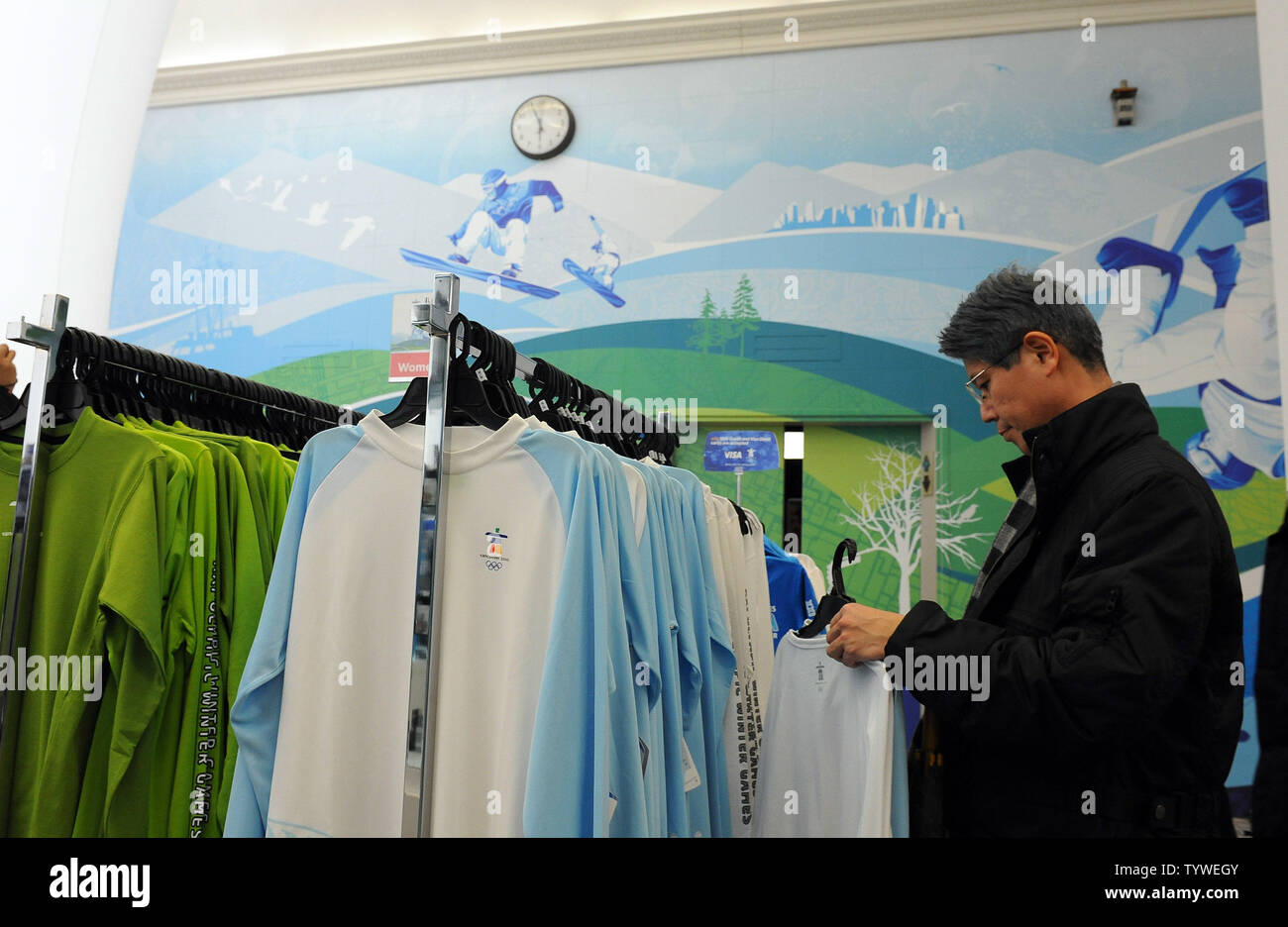 Shoppers browse Olympic merchandise at the Olympic superstore in a ...