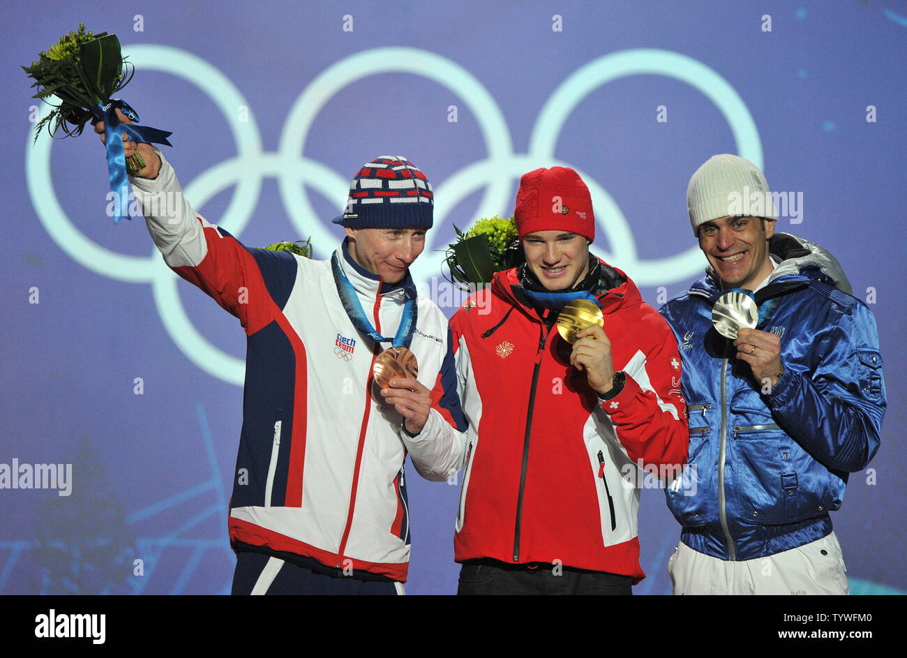 Gold medalist Switzerland's Dario Cologna (C), silver medalist Italy's Pietro Piller Cottrer (R) and bronze medalist Czech Republic's Lukas Bauer pose during the victory ceremony for the Men's Cross-Country Skiing 15 km Free competition at the 2010 Vancouver Winter Olympics, at Whistler Creekside in Whistler, Canada, February 15, 2010.  UPI/Kevin Dietsch Stock Photo