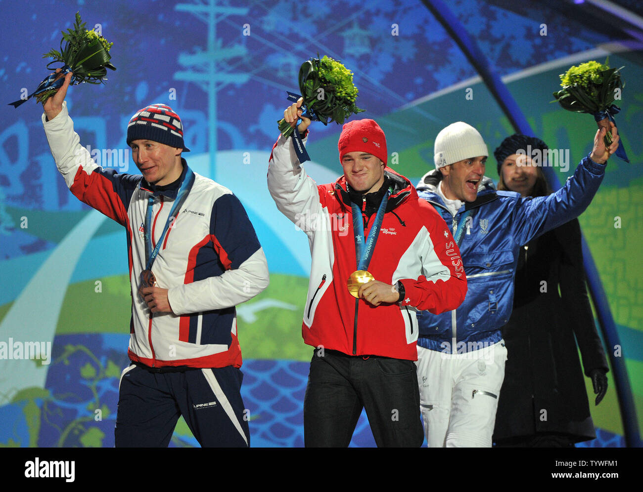 Gold medalist Switzerland's Dario Cologna (C), silver medalist Italy's Pietro Piller Cottrer (R) and bronze medalist Czech Republic's Lukas Bauer leave the podium during the victory ceremony for the Men's Cross-Country Skiing 15 km Free competition at the 2010 Vancouver Winter Olympics, at Whistler Creekside in Whistler, Canada, February 15, 2010.  UPI/Kevin Dietsch Stock Photo