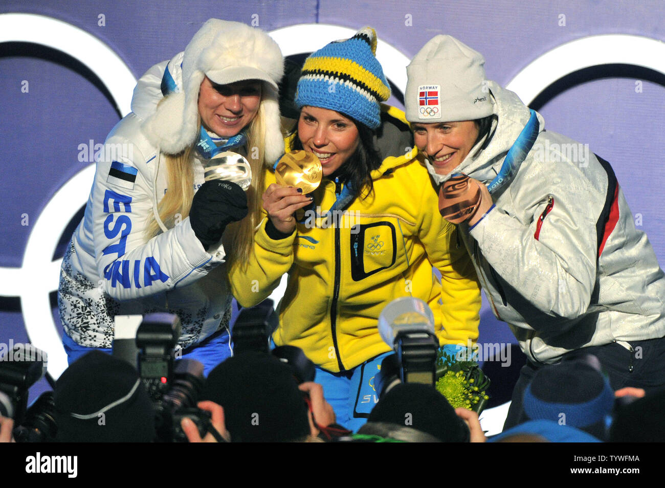 Gold medalist Sweden's Charlotte Kalla (C), silver medalist Estonia's Kristina Smigun-Vaehi (L) and bronze medalist Norway's Marit Bjoergen pose during the victory ceremony for the Women's Cross-Country Skiing 15 km Free competition at the 2010 Vancouver Winter Olympics, at Whistler Creekside in Whistler, Canada, February 15, 2010.  UPI/Kevin Dietsch Stock Photo