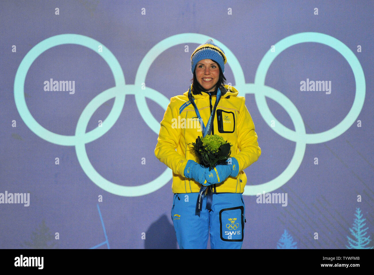 Gold medalist Sweden's Charlotte Kalla receives her medal during the victory ceremony for the Women's Cross-Country Skiing 15 km Free competition at the 2010 Vancouver Winter Olympics, at Whistler Creekside in Whistler, Canada, February 15, 2010.  UPI/Kevin Dietsch Stock Photo
