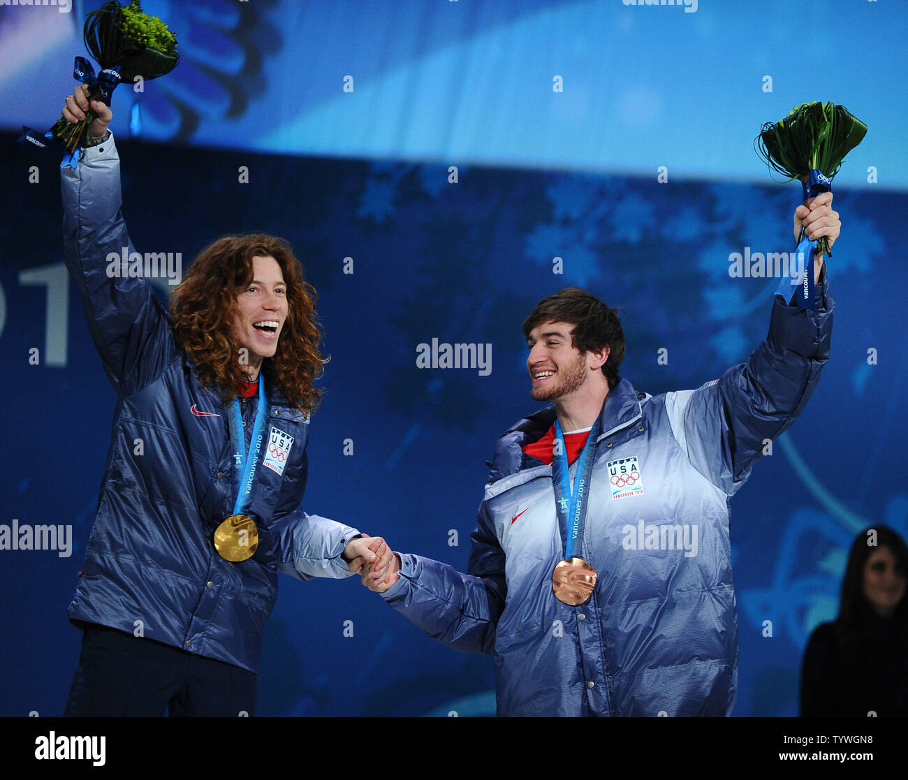 Shaun White (left, gold medal) and Scott Lago (bronze) of the United States celebrate their medals in men's snow boarding half pipe during a Medal Ceremony at BC Place in Vancouver, Canada, during the 2010 Winter Olympics on February 18, 2010.     UPI/Roger L. Wollenberg Stock Photo