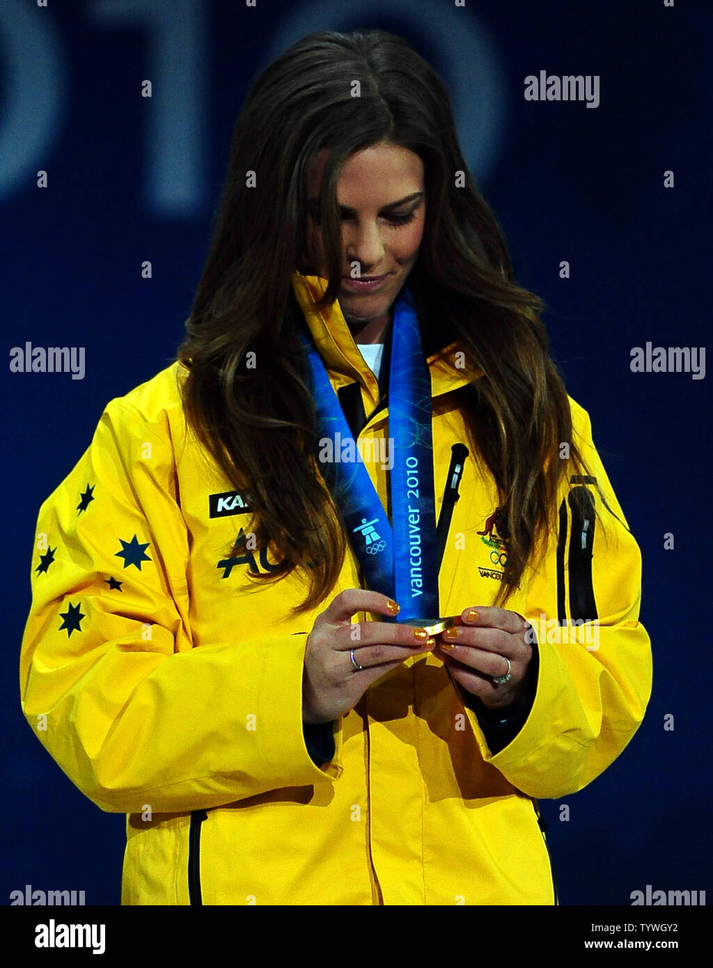 Torah Bright of Australia (gold) looks at the medal she earned for snowboard ladies' halfpipe at BC Place in Vancouver, Canada, during the 2010 Winter Olympics on February 19, 2010.     UPI/Roger L. Wollenberg Stock Photo