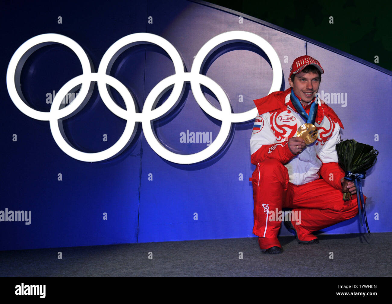 Gold medalist Russia's Evgeny Ustyugov poses with his medal during the victory ceremony for the Men's Biathlon 15 km Mass Start during the 2010 Vancouver Winter Olympics in Whistler, Canada on February 21, 2010. UPI/Kevin Dietsch Stock Photo