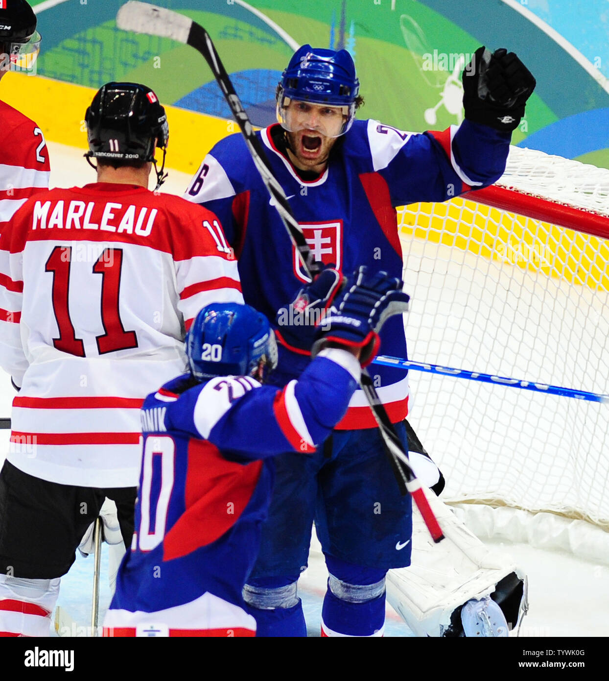 Slovakia's Michal Handzus celebrates his goal against Canada with  Slovakia's Richard Zednik during the third period of their semifinal game  at Canada Hockey Place in Vancouver, Canada, during the 2010 Winter Olympics