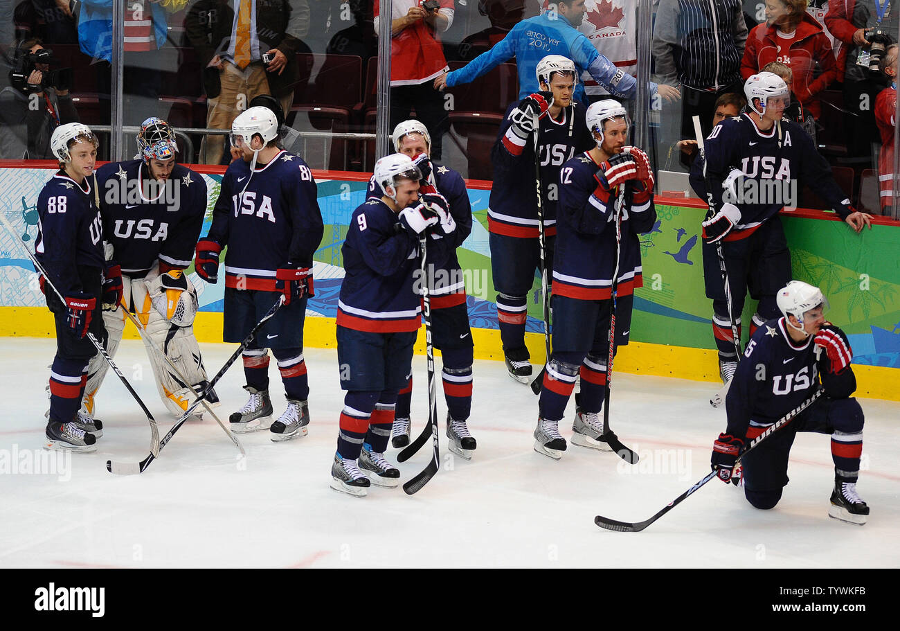 Members of Team USA watch Team Canada celebrate their overtime win in the gold medal mens ice hockey game at Canada Hockey Place in Vancouver, Canada, during the 2010 Winter Olympics on