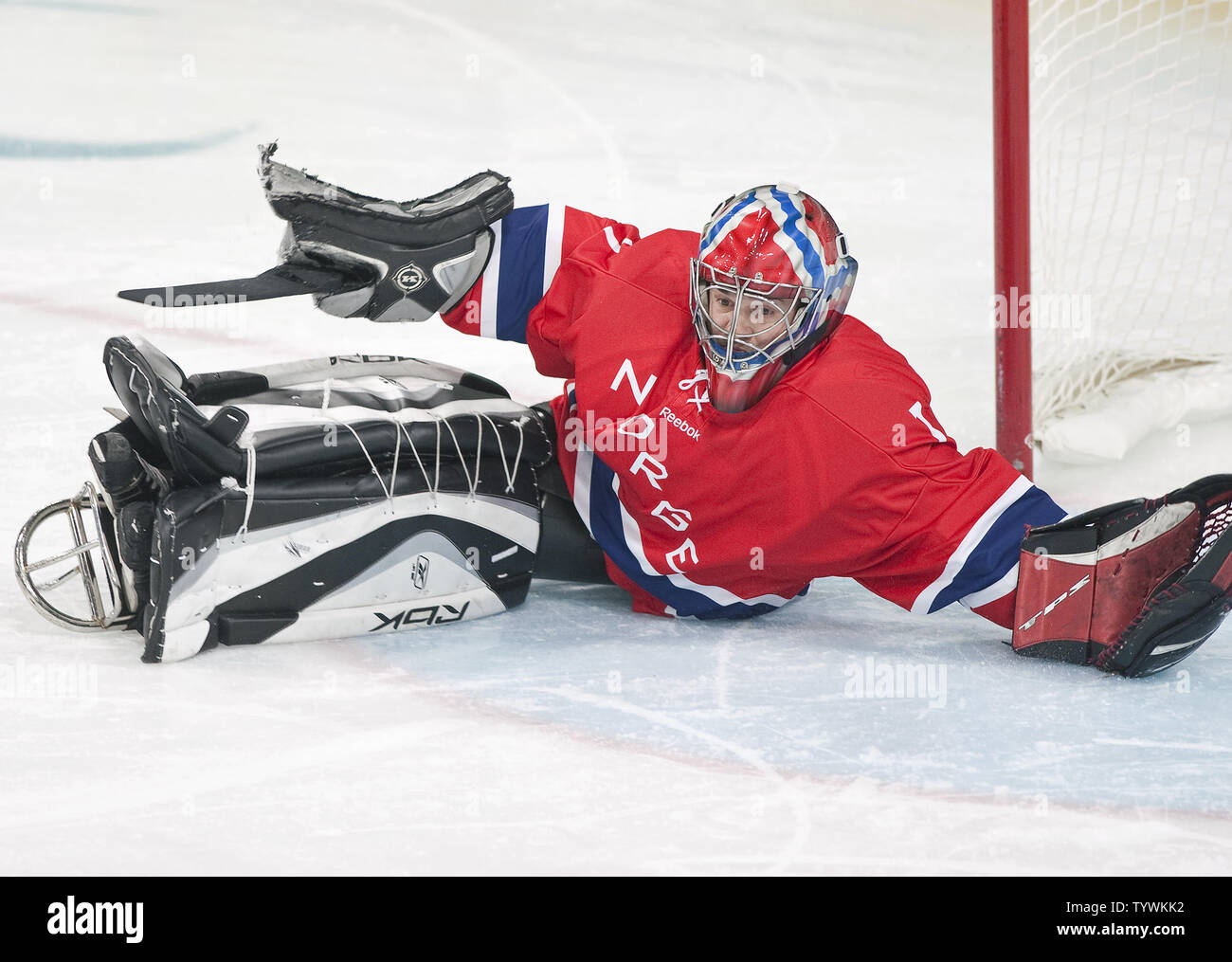 Team Norway goalie Roger Johansen defends against a break away from Team  Canada in the first period of preliminary round sledge hockey during the  Vancouver 2010 Winter Paralympics at UBC Thunderbird Arena