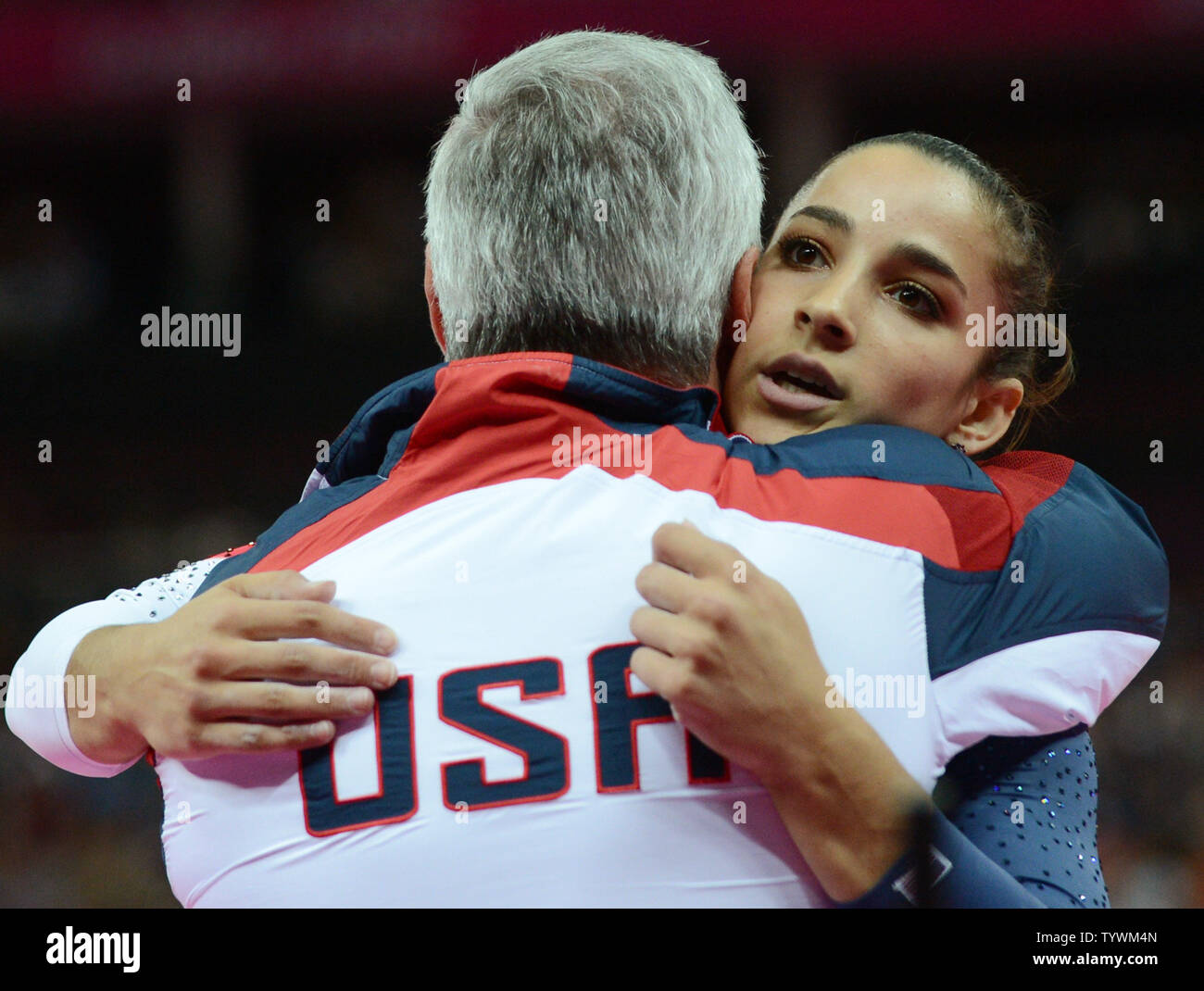 USA's Alexandra Raisman hugs her coach after her bronze medal ...