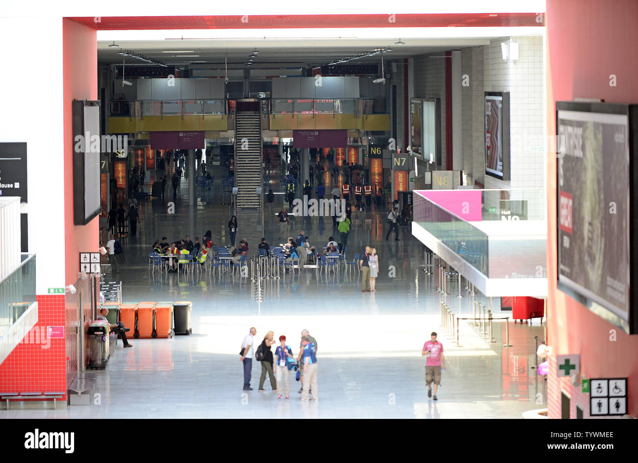 People wander in the main corridor at the ExCel exhibition center, venue for many sports prior to the Summer Olympics in London on July 26, 2012.   UPI/Ron Sachs Stock Photo