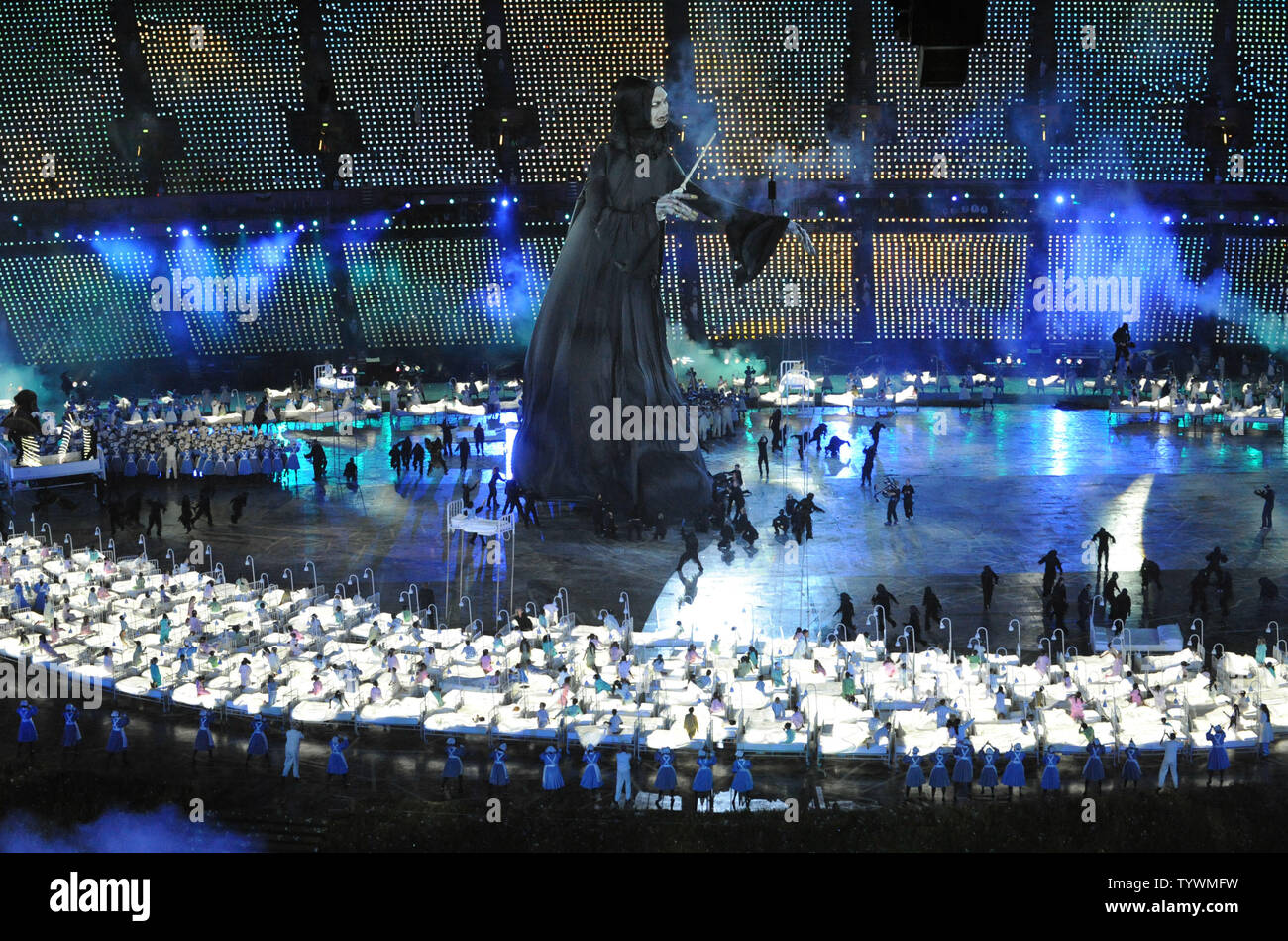 A grim reaper figure is seen during the tribute to health care scene during the Opening Ceremony of the London 2012 Summer Olympics on July 27, 2012 in Stafford, London. The show, created by Academy Award winning director Danny Boyle, celebrates England's history through the use of pop-culture and history.  UPI/Pat Benic Stock Photo