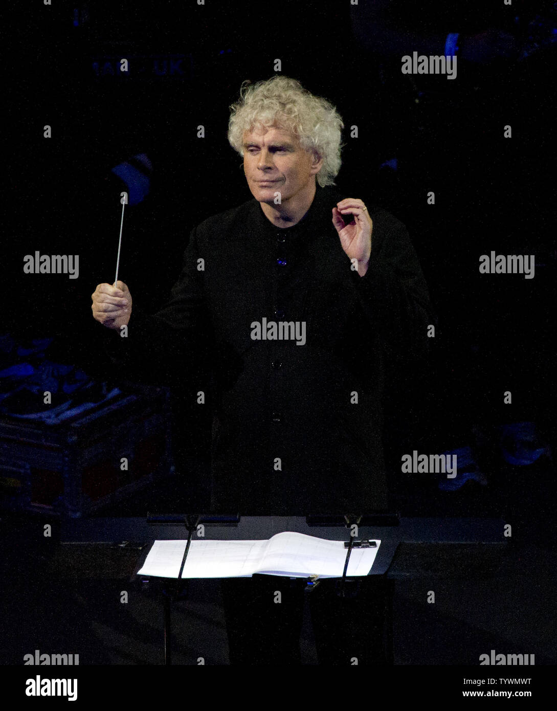 Sir Simon Rattle conducts the London Symphony Orchestra in a performance of 'Chariots of Fire' during the Opening Ceremony at the London 2012 Summer Olympic Games on July 27, 2012 in London.   UPI/Ron Sachs Stock Photo