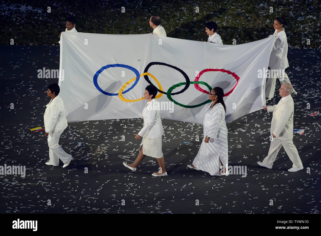 The Olympic flag enters the Olympic stadium during the Opening Ceremony of the London 2012 Summer Olympics on July 27, 2012 in Stratford, London.  UPI/Pat Benic Stock Photo