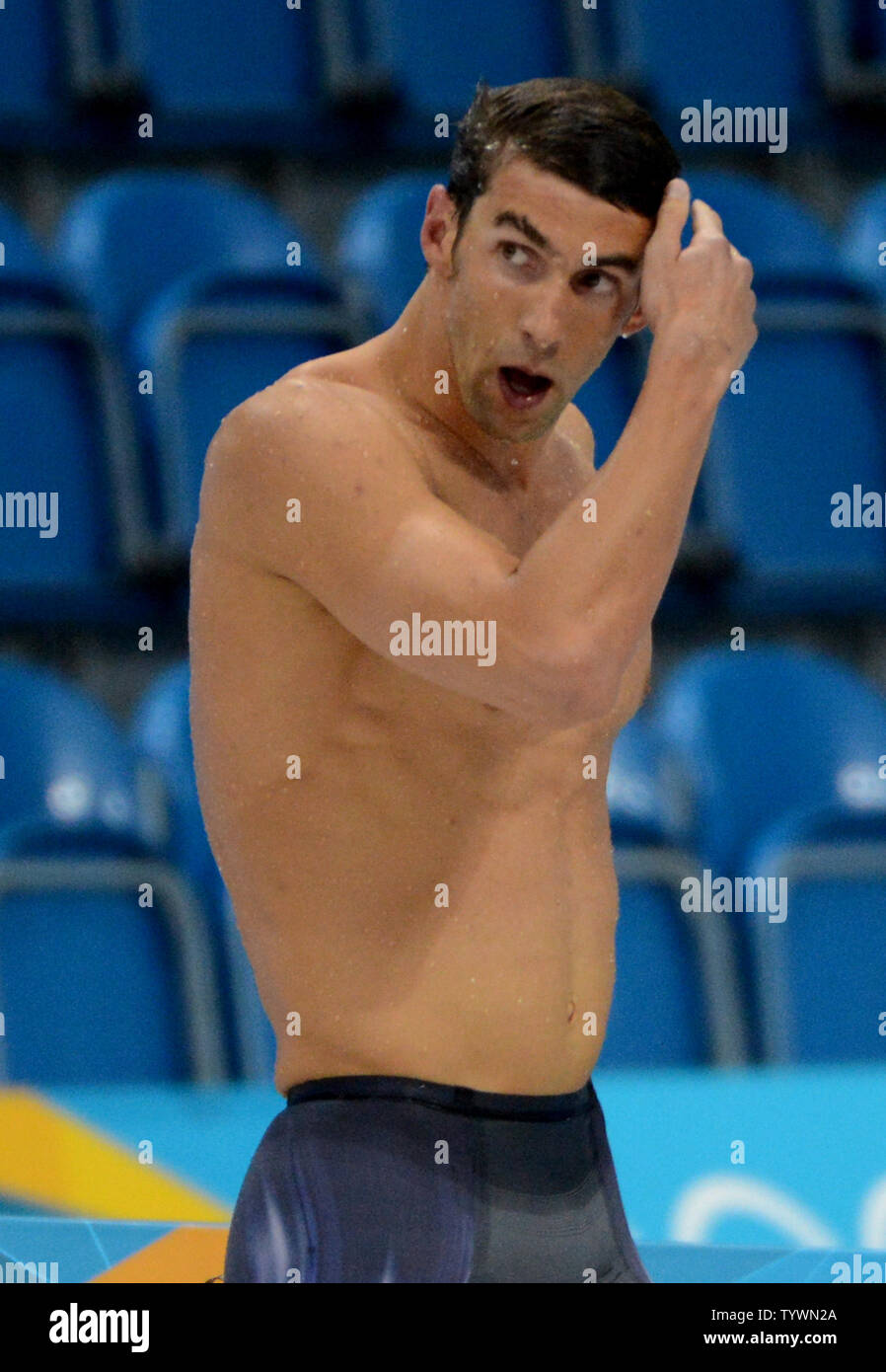 USA's Michael Phelps looks up the clock as he finishes fourth and out of the medals in the Men's 400 Individual Medley Final at the Aquatics Center during the London 2012 Summer Olympics in Stratford, London on July 28, 2012.    Phelps won eight gold medals in Beijing.   UPI/Pat Benic Stock Photo