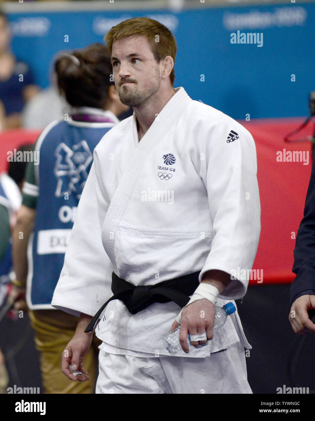 Colin Oates of Great Britain walks away from the floor after losing to Jun-Ho Cho of the Republic of Korea (South Korea) in the Men's Judo 66kg Repechage contest at the London 2012 Summer Olympic Games on July 29, 2012 in London. Jun-Ho Cho won the contest.  UPI/Ron Sachs Stock Photo