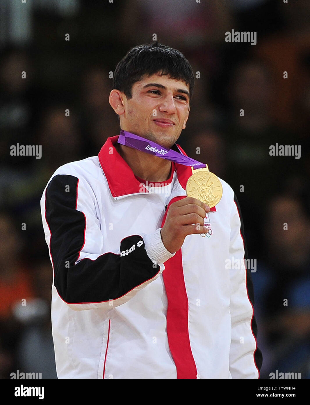 Lasha Shavdatuashvili of Georgia shows off his Gold Medal from his victory in the Men's Judo 66kg contest at the London 2012 Summer Olympic Games on July 29, 2012 in London. UPI/Ron Sachs Stock Photo