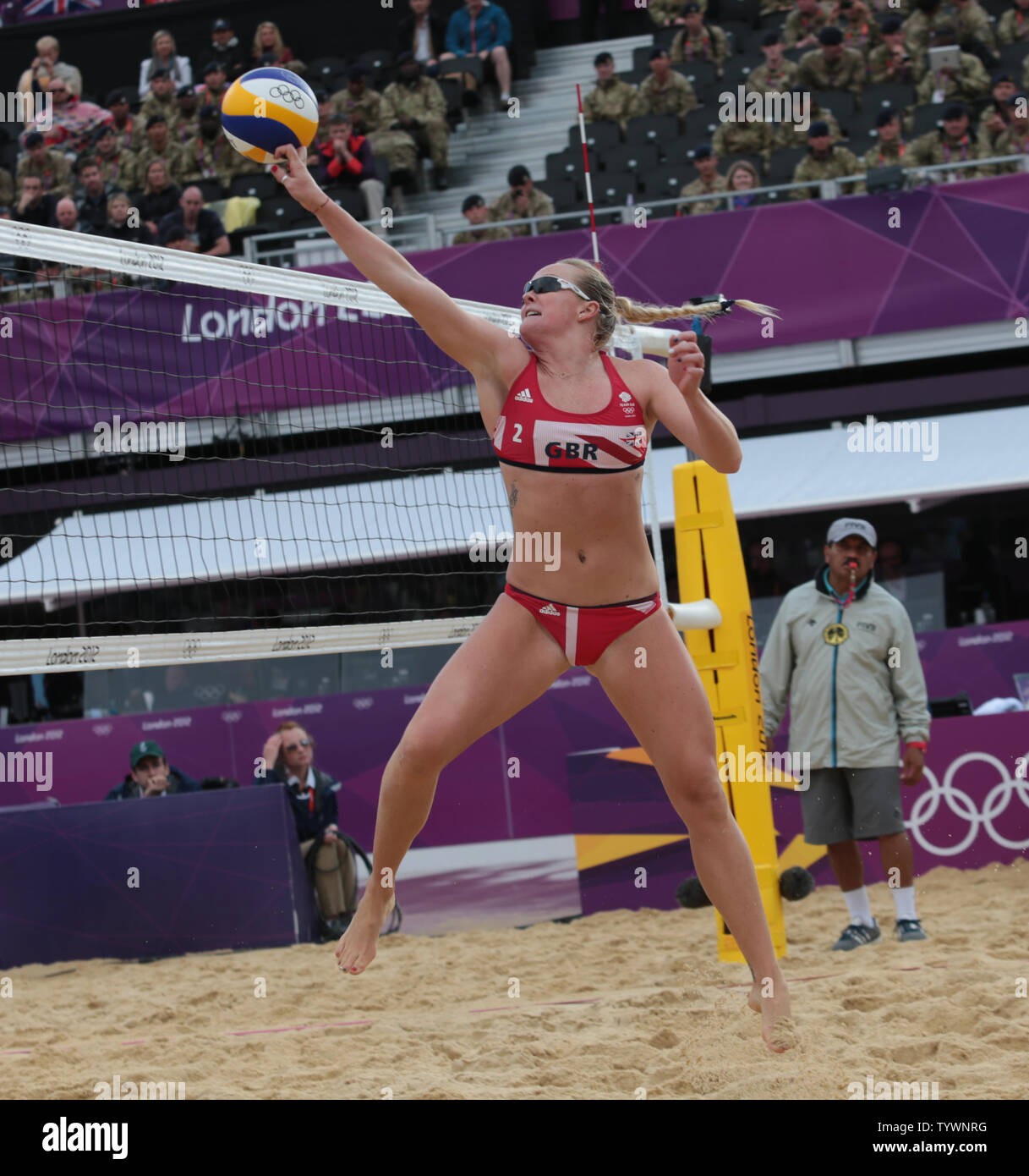 Great Britain's Zara Dampney tips the ball over the net in the Women's Beach Volleyball match against Canada at the London 2012 Summer Olympics on July 29, 2012 in London.      UPI/Hugo Philpott Stock Photo