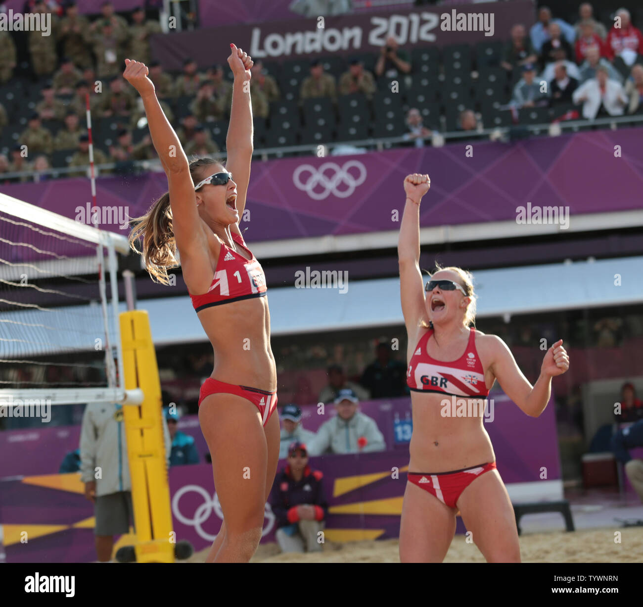 Great Britain's Zara Dampney and Shauna Mullin celebrate victory over Canada in the Women's Beach Volleyball at the London 2012 Summer Olympics on July 29, 2012 in London.      UPI/Hugo Philpott Stock Photo
