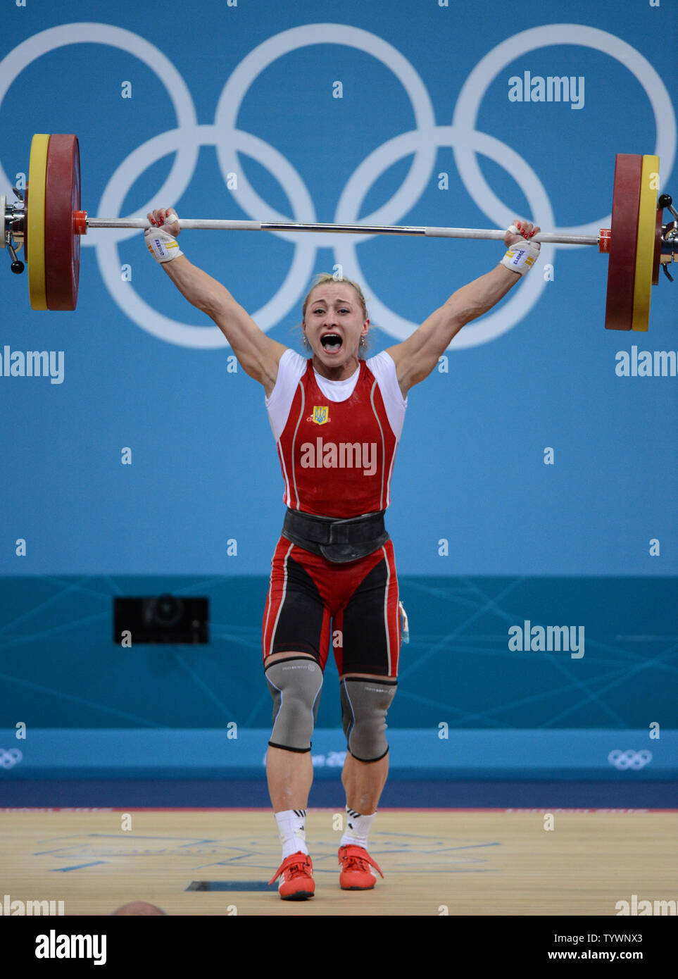 Yuliya Kalina of Ukraine celebrates a good lift in Women's 58kg
