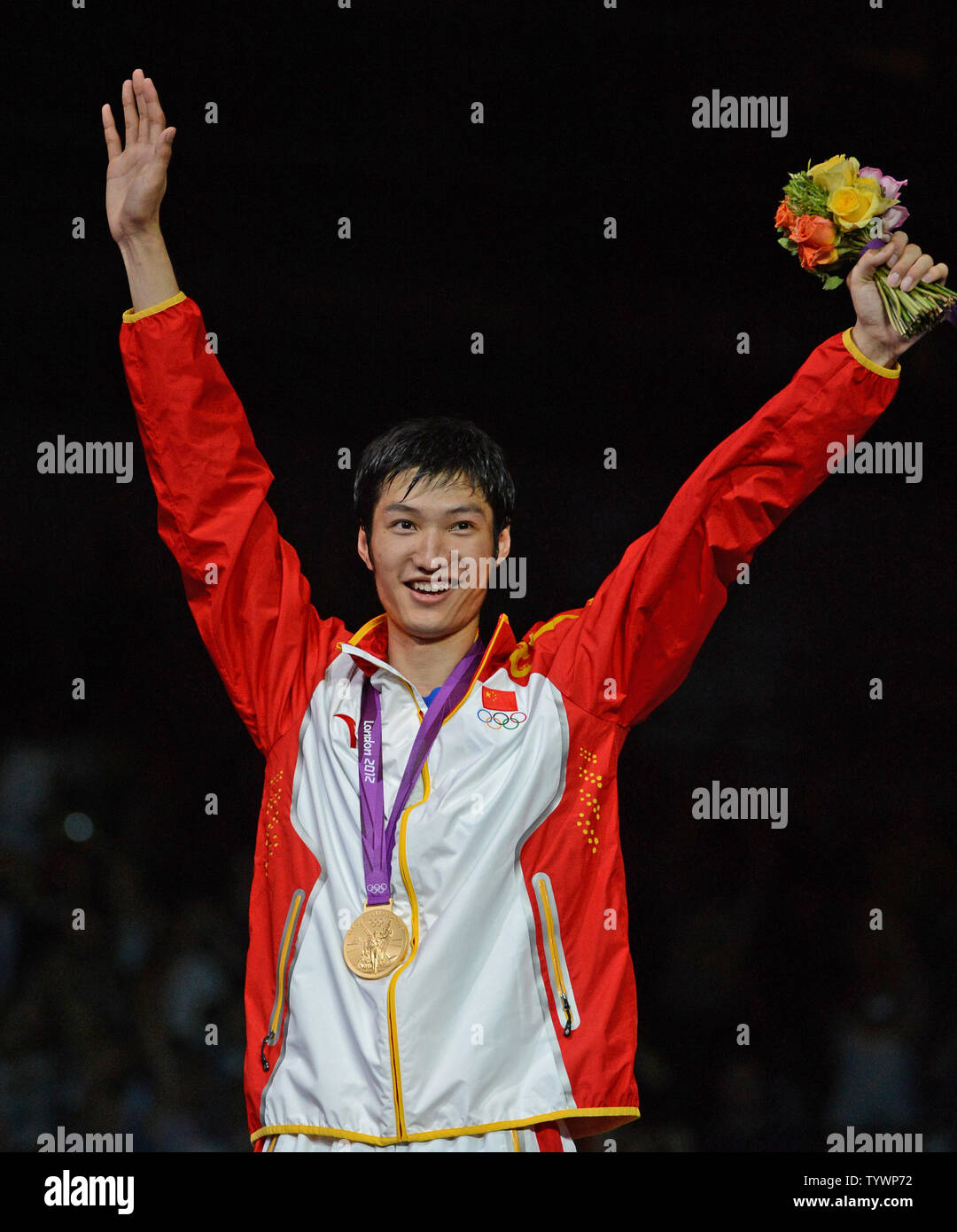 Lei Sheng of China wears the men's Foil Individual gold medal after ...