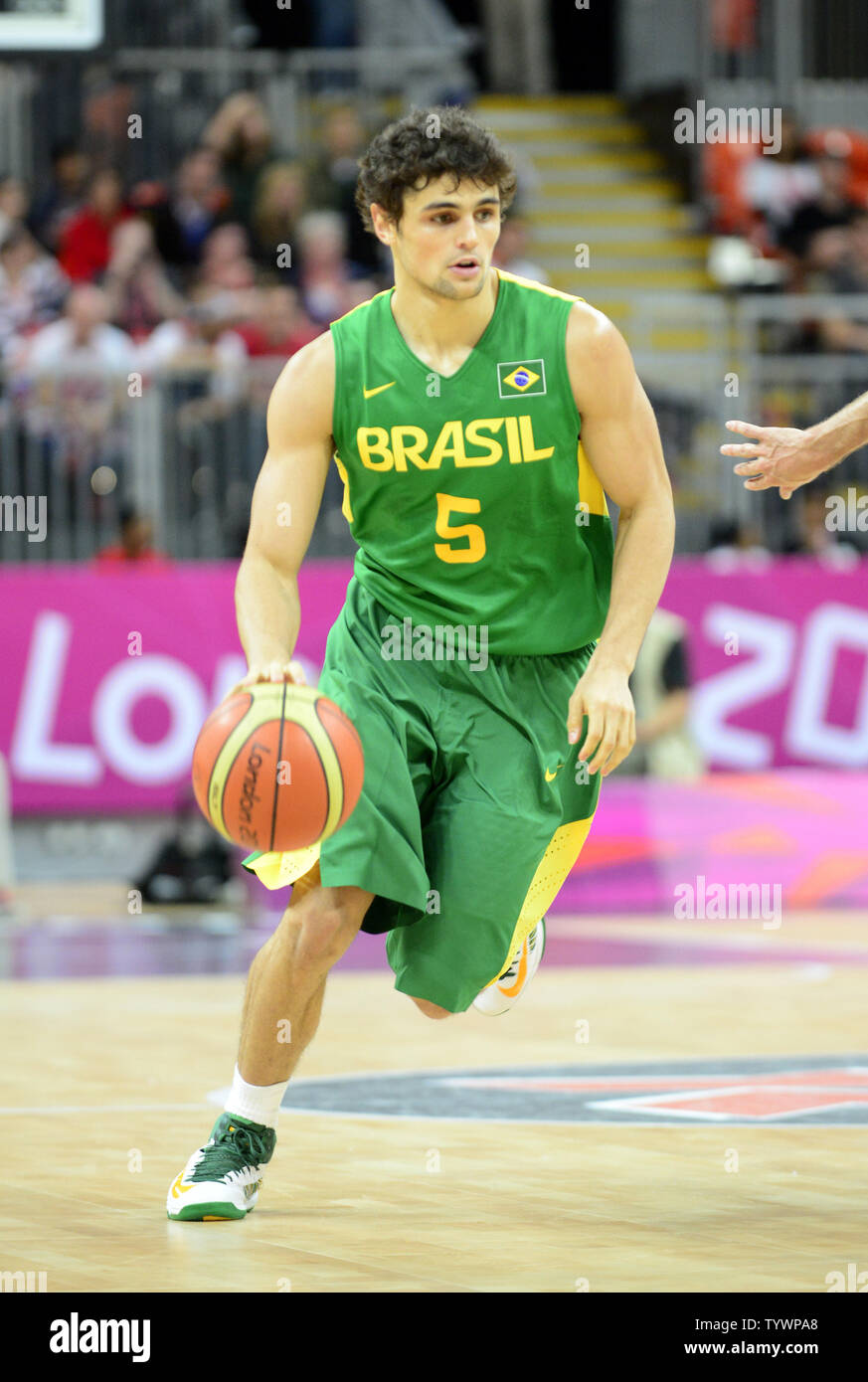 Raul Neto (5) of Brazil dribbles the ball in the first half of the Great Britain v. Brazil preliminary round - group B basketball game at the London 2012 Summer Olympics on July 31, 2012 in London.   UPI/Ron Sachs Stock Photo