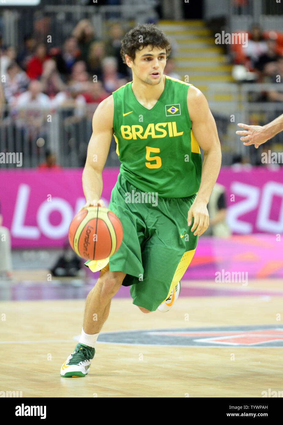Guard Raul Neto (5) of Brazil dribbles in first half action against Great Britain in a preliminary round - group B basketball game at the London 2012 Summer Olympics on July 31, 2012 in London.  Brazil won the game 67 - 62.  UPI/Ron Sachs Stock Photo