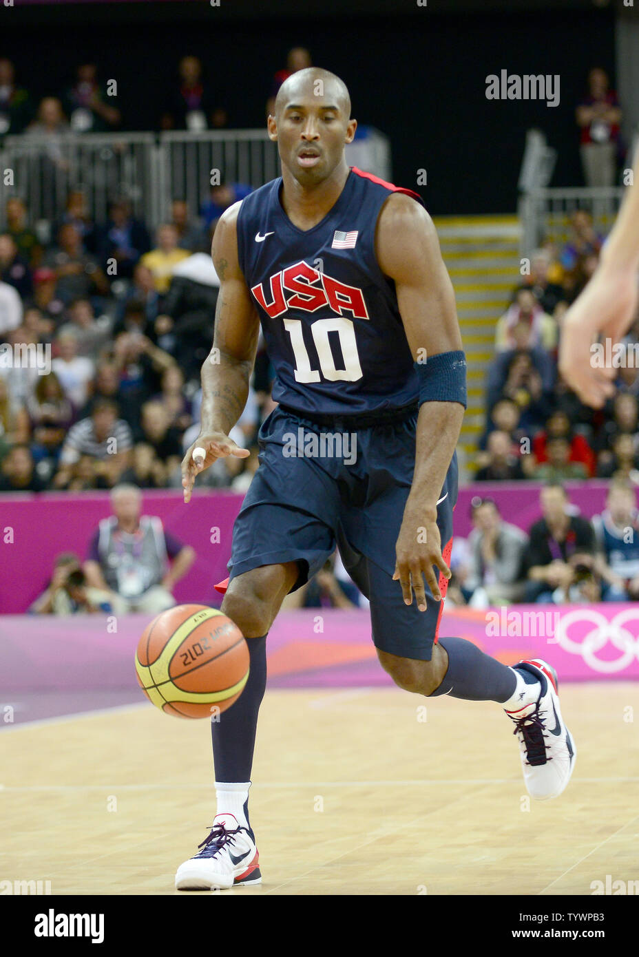 Guard Kobe Bryant 10 of the United States dribbles the ball in