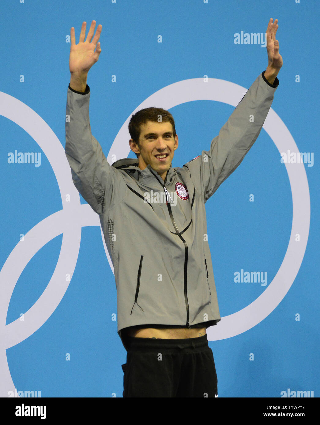 Michael Phelps of the United States acknowledges the cheers of the crowd during the medal ceremony following the Men's 200m Individual Medley Final at the London 2012 Summer Olympics on August 2, 2012 in London.  Phelps won the Gold Medal, finishing with a time of 1:54.27.  UPI/Ron Sachs Stock Photo