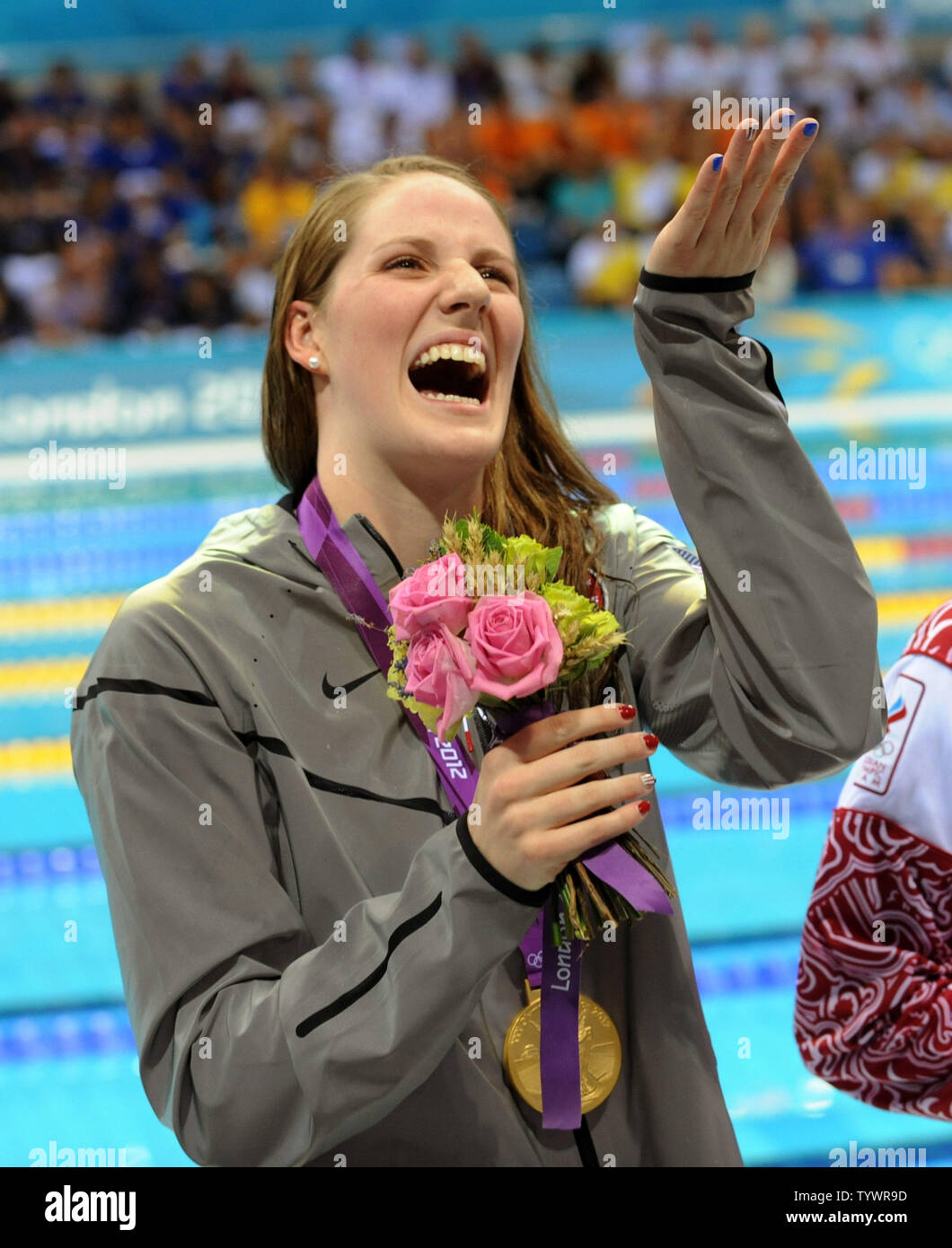 USA's Missy Franklin blows a kiss to the crowd with her gold medal in the Women's 200M Backstroke Final at the Aquatics Center during the London 2012 Summer Olympics in Stratford, London on August 3, 2012.    UPI/Pat Benic Stock Photo