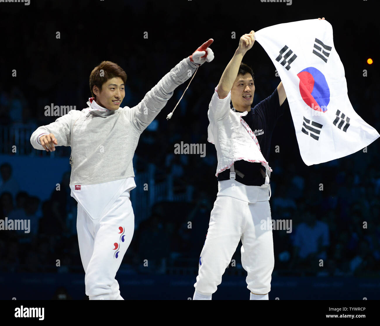 Members of the Republic of Korea (South Korea) Men's Sabre Team celebrate their winning the Gold Medal over Romania at the London 2012 Summer Olympics on August 3, 2012 in London. The final score was 45 - 26.   UPI/Ron Sachs Stock Photo