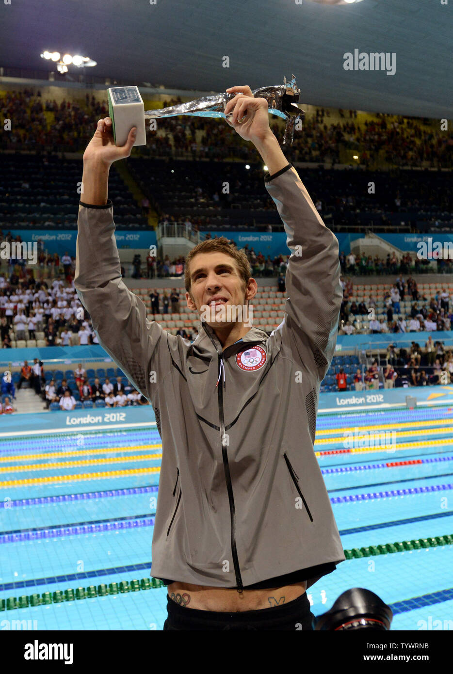 Michael Phelps holds a special Olympic recognition trophy after he won his 18th gold in the Men's 4x100 Medley Relay Final at the Aquatics Center during the London 2012 Summer Olympics in Stratford, London on August 4, 2012.  Phelps won his record 18th gold and 22nd Olympic Medals to end his Olympic career.   UPI/Pat Benic Stock Photo