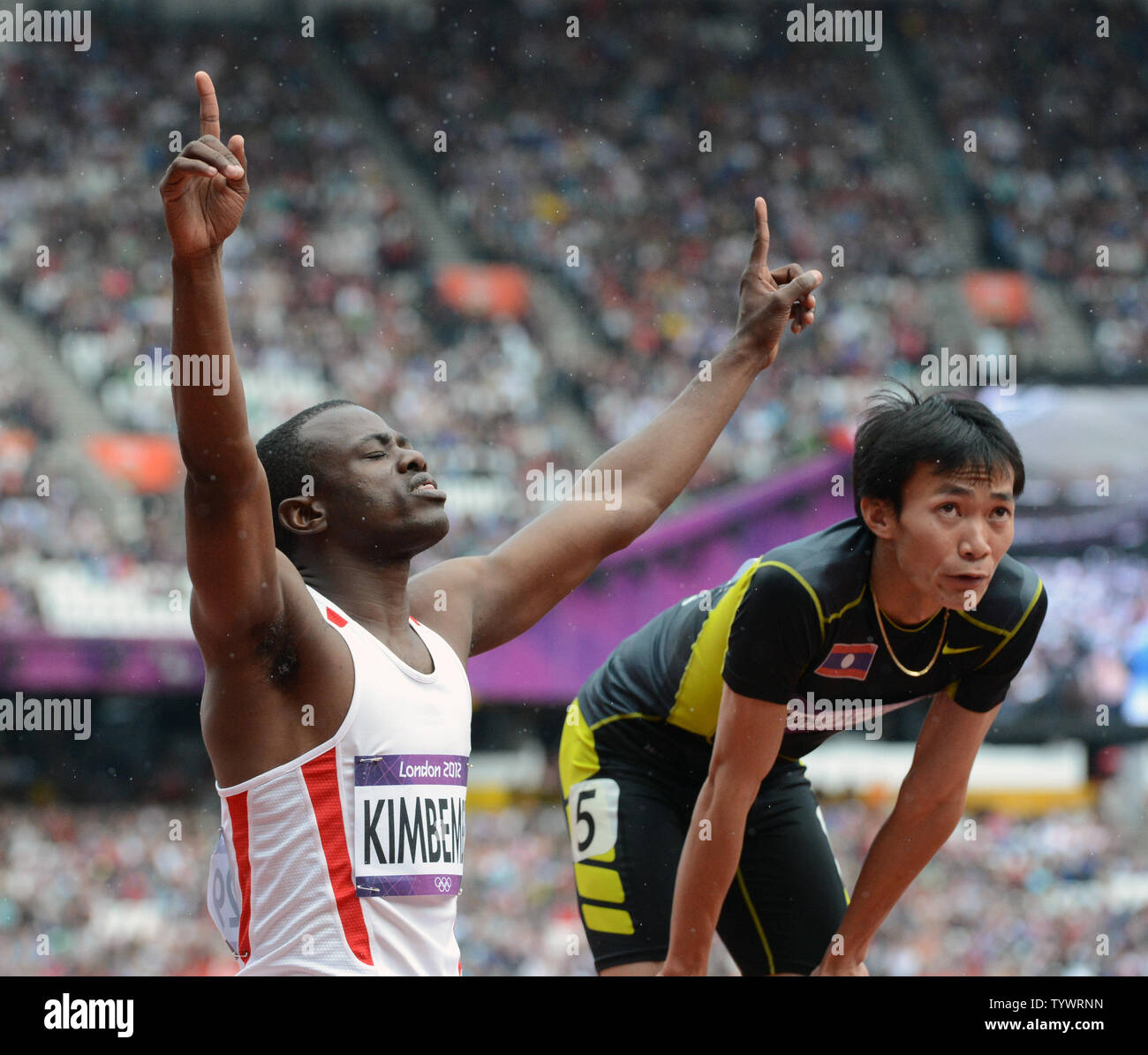 Devilert Arsene Kimbembe of the Congo celebrates his finish as Kilakone