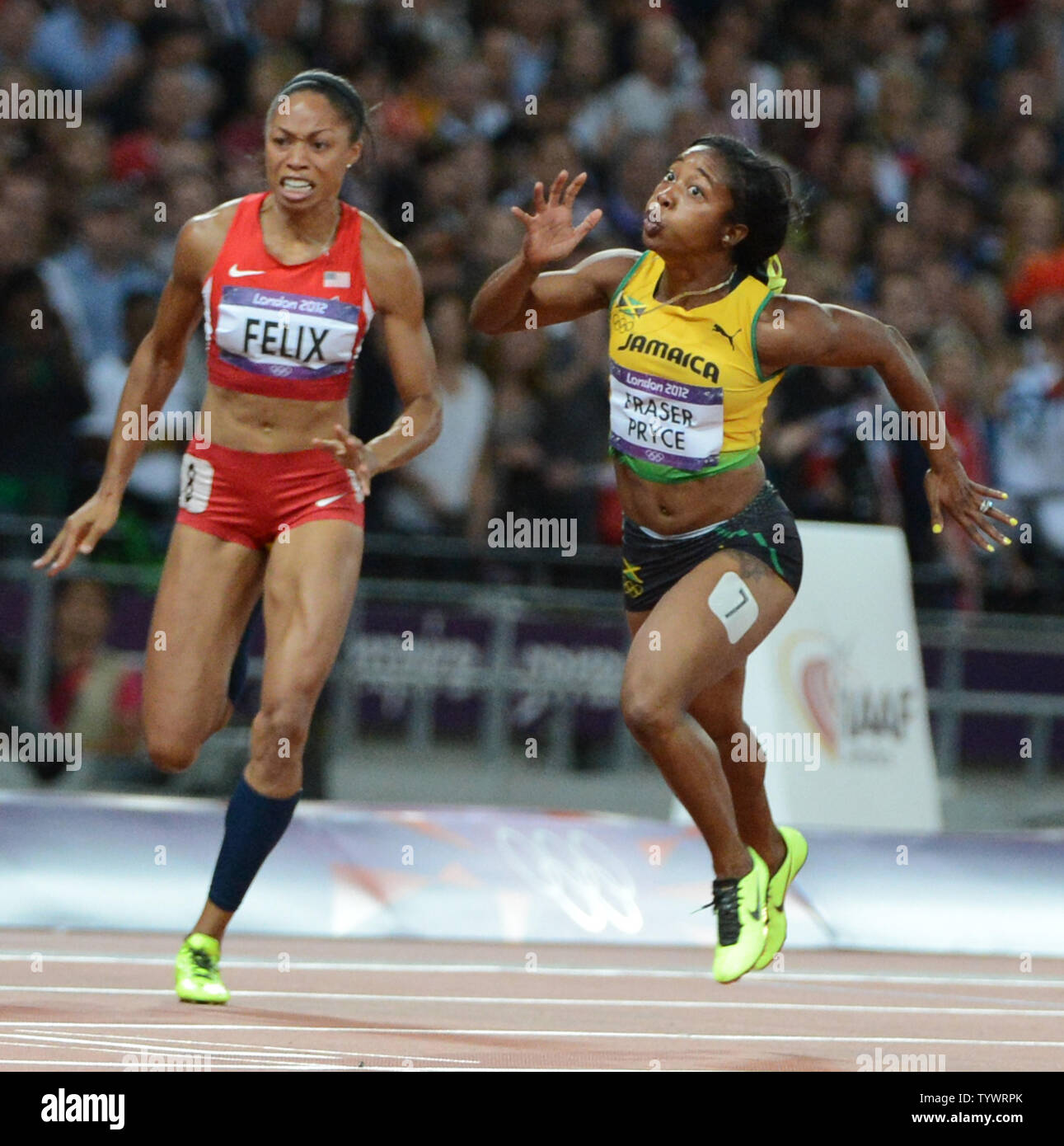 Shelly-Ann Fraser-Pryce of Jamaica (R) beats out Allyson Felix of the USA in the Women's 100M at the London 2012 Summer Olympics on August 3, 2012 in London.    UPI/Terry Schmitt Stock Photo
