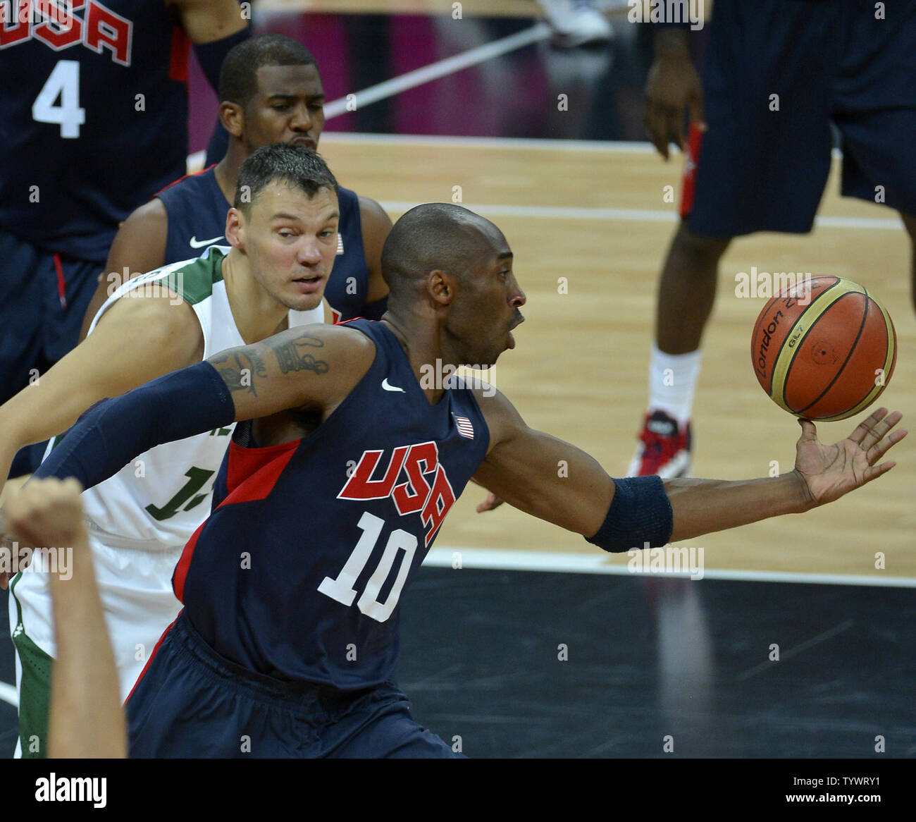 America's Kobe Bryant grabs for a loose ball in front of Lithuania's Sarunas Jasikevicius during the USA-Lithuania Men's Basketball Preliminary competition at the 2012 Summer Olympics, August 4, 2012, in London, England.             UPI/Mike Theiler Stock Photo