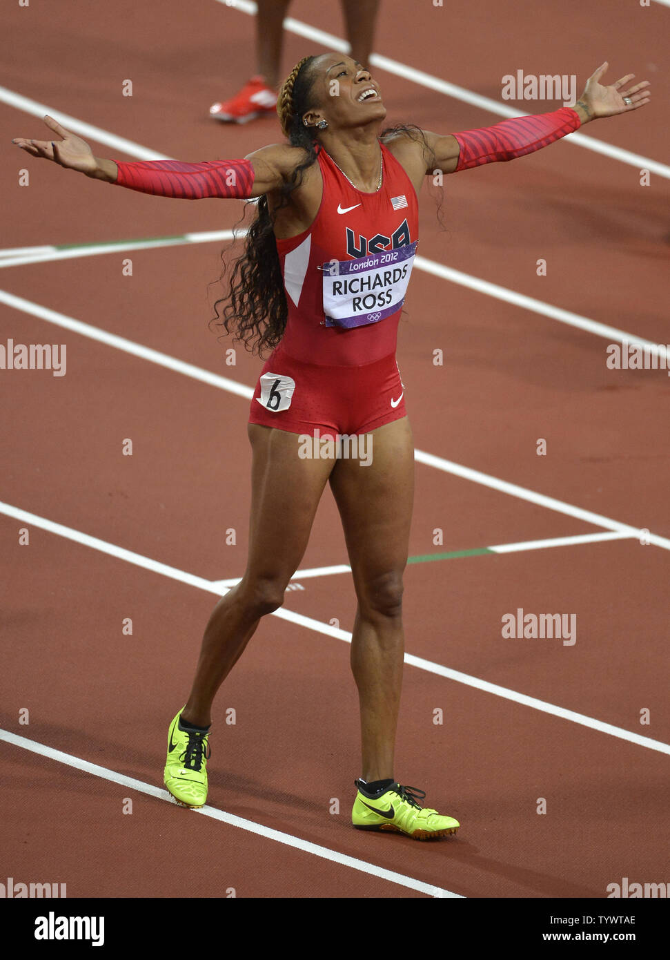 American sprinter Sanya Richards-Ross raises her arms in jubilation