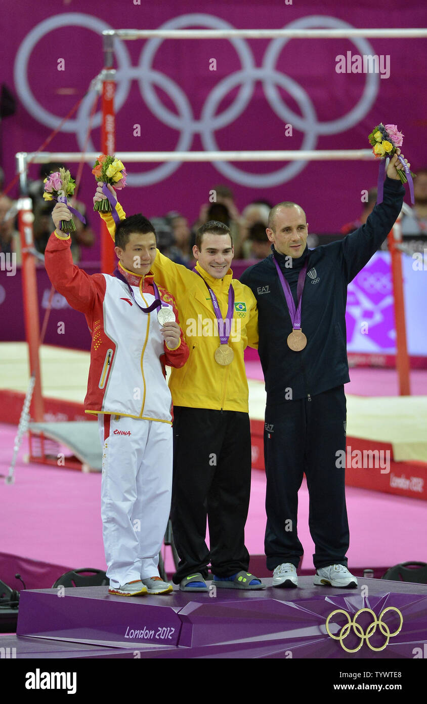 Gymnastics medal winners for the Apparatus Finals on the rings (L-R) China's Yibing Chen (silver medal), Brazil's Arthur Nabarette Zanetti (gold medal) and Italy's Matteo Morandi (bronze medal), during the awards ceremony, at the Greenwich North Arena at the 2012 Summer Olympics, August 6, 2012, in London, England.              UPI/Mike Theiler Stock Photo