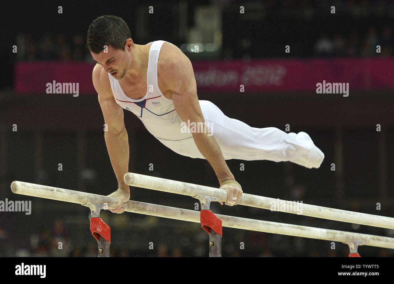French gymnast Hamilton Sabot goes through his routine during the Apparatus  Finals on the parallel bars, as he wins the bronze medal at the Greenwich  North Arena at the 2012 Summer Olympics,