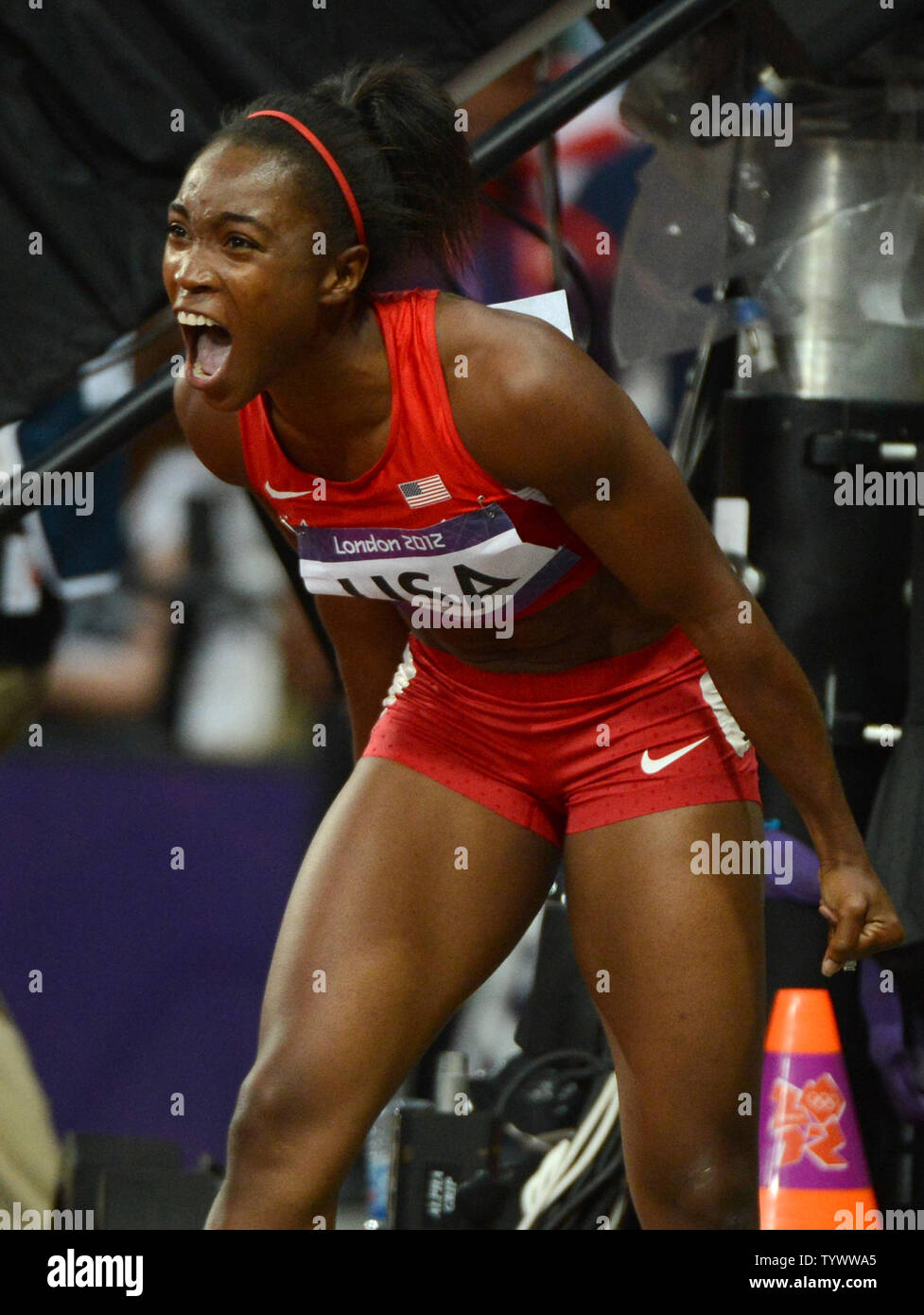 Tianna Madison of the USA celebrates winning the gold medal and setting a new world record in the Women's 4x100M Relay at the London 2012 Summer Olympics on August 10, 2012 in London.    UPI/Terry Schmitt Stock Photo