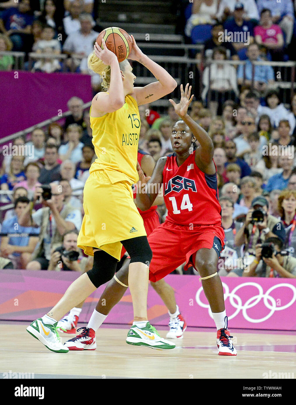 Forward/center Lauren Jackson (15) of Australia looks to pass the ball against center/forward Tina Charles (14) of the United States of America in the Women's Basketball semifinal at the London 2012 Summer Olympics on August 9, 2012 in London. The United States won the game 86 - 73 to advance to the finals.   UPI/Ron Sachs Stock Photo
